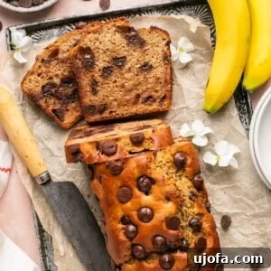 protein banana bread with chocolate chips on a parchment lined baking sheet