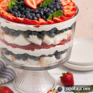 berry angel food trifle with mint in a glass bowl