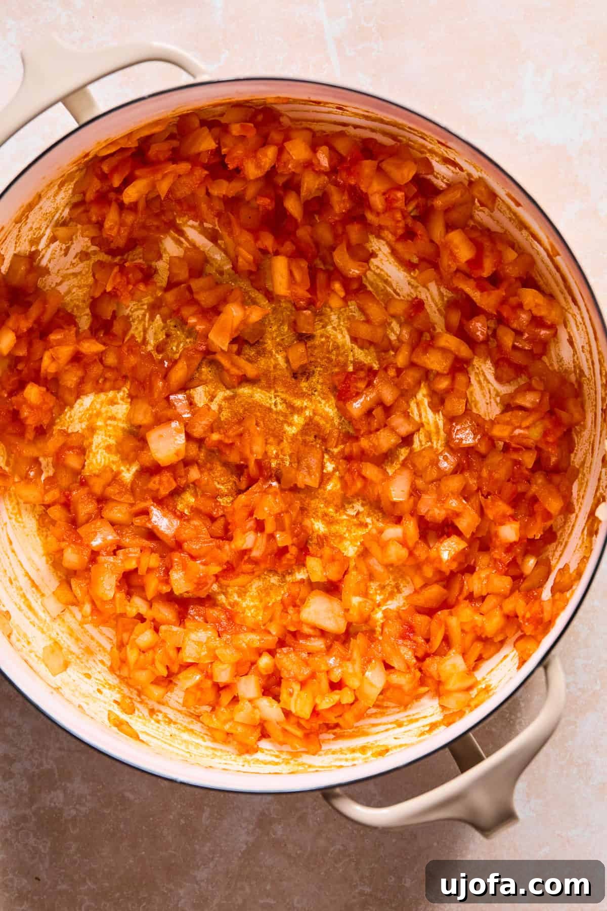 Hearty Shepherd's Pie Soup 6 Tomato paste added to Dutch Oven with onion and garlic.