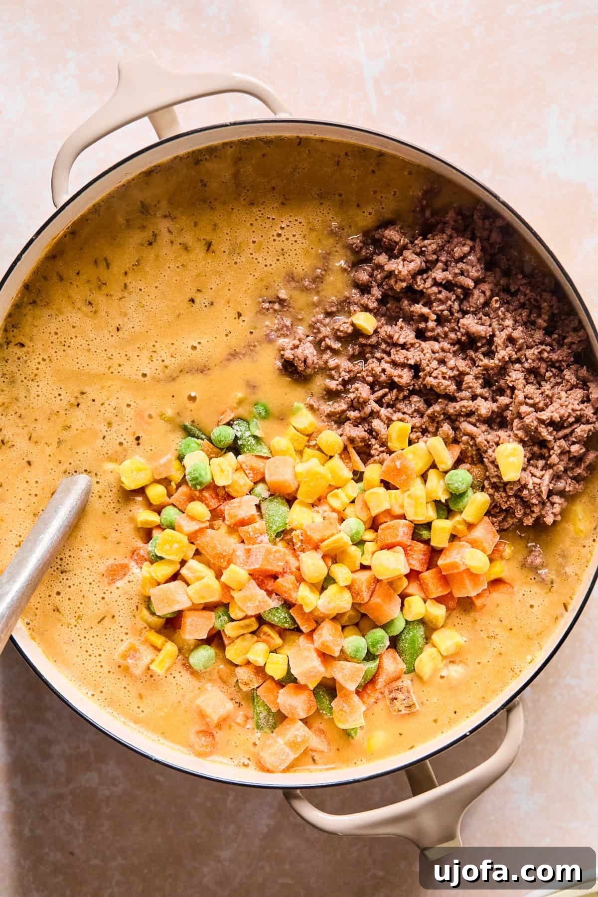 Hearty Shepherd's Pie Soup 10 Stirring cooked ground beef and frozen vegetables into shepherd's pie soup.