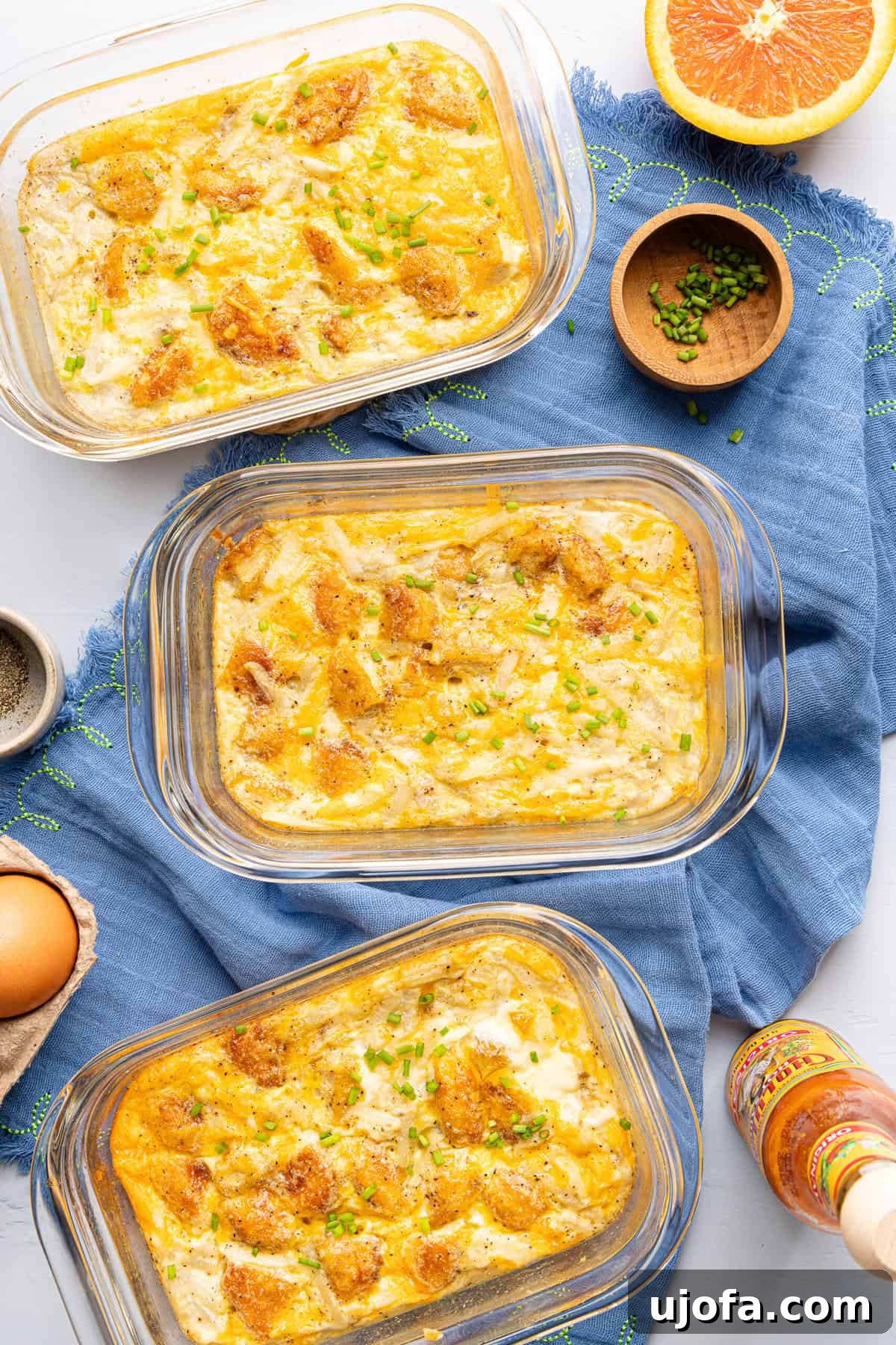 Chick-fil-A Inspired Hash Brown Breakfast Bowls 2 meal prep hash brown scramble bowls on a blue napkin, ready to be enjoyed