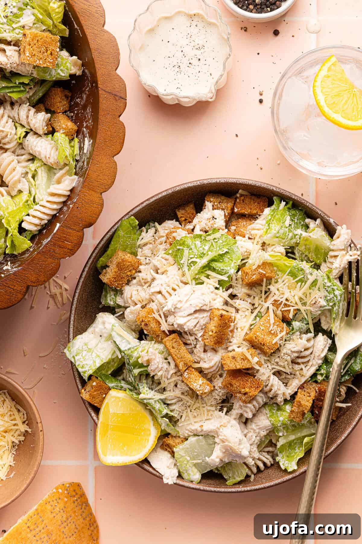 Effortless Gluten-Free Chicken Caesar Pasta Salad 2 chicken caesar pasta salad in a bowl with a silver fork