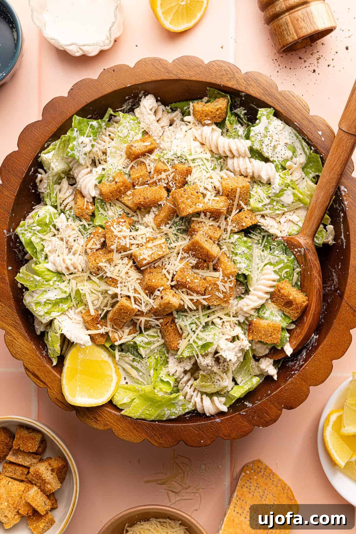 Effortless Gluten-Free Chicken Caesar Pasta Salad 8 chicken caesar pasta salad topped with croutons in a wooden bowl