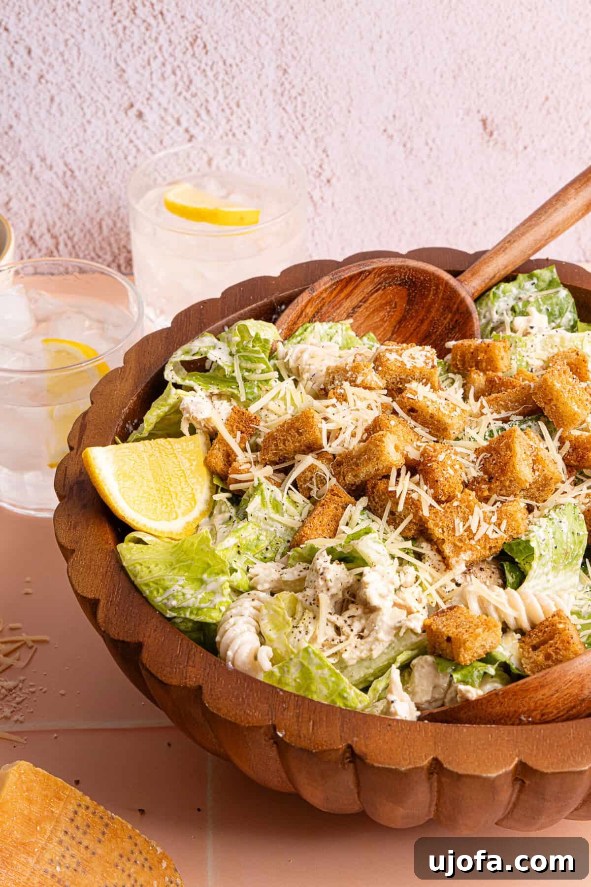 Effortless Gluten-Free Chicken Caesar Pasta Salad 9 a side view of a bowl of chicken pasta salad with lettuce