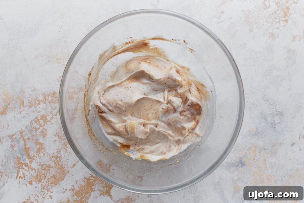 Velvety Vegan Fruit Dip 5 All dairy-free fruit dip ingredients combined in a medium bowl before whisking.