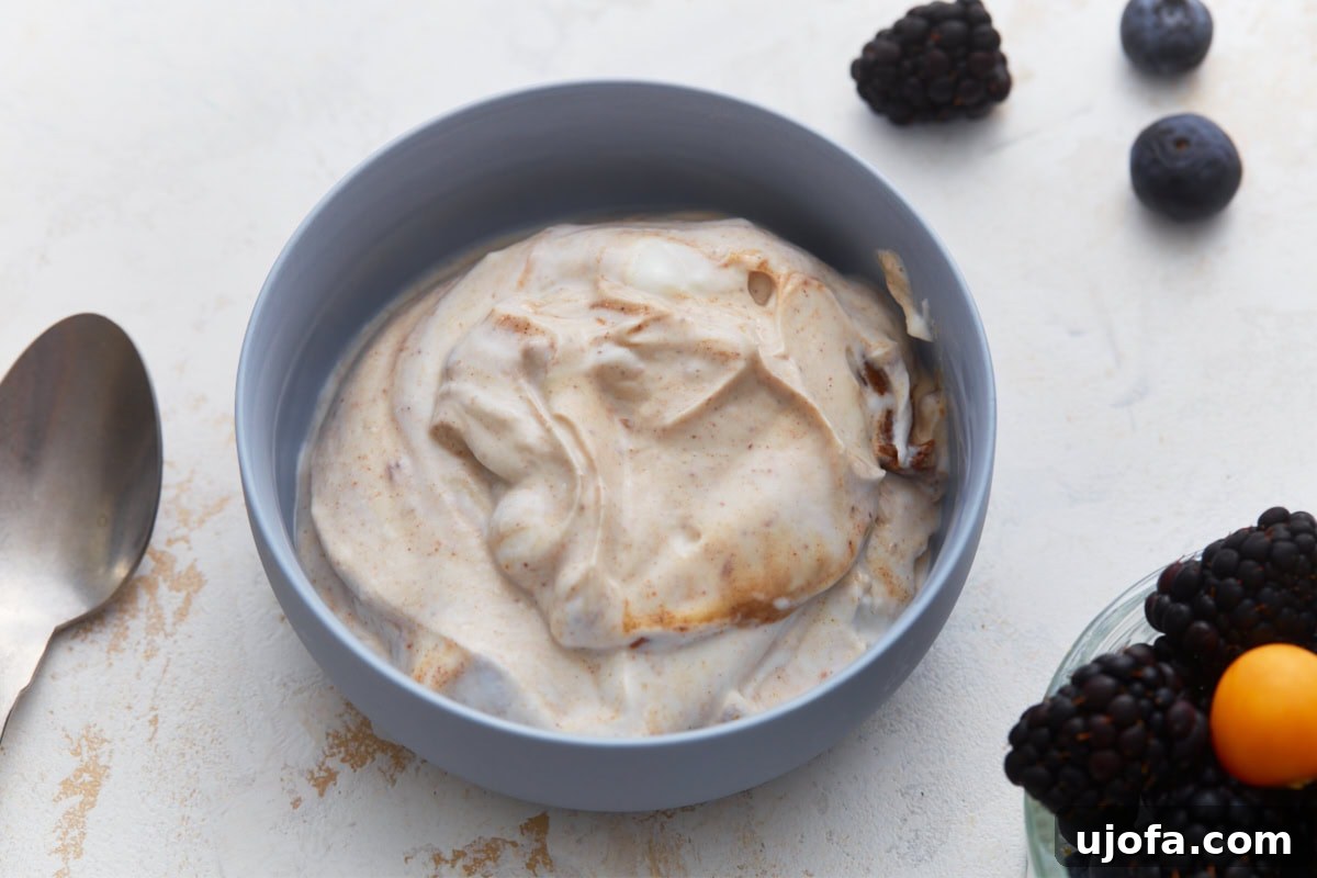Velvety Vegan Fruit Dip 6 Dairy-free fruit dip being whisked in a medium bowl until smooth and creamy.
