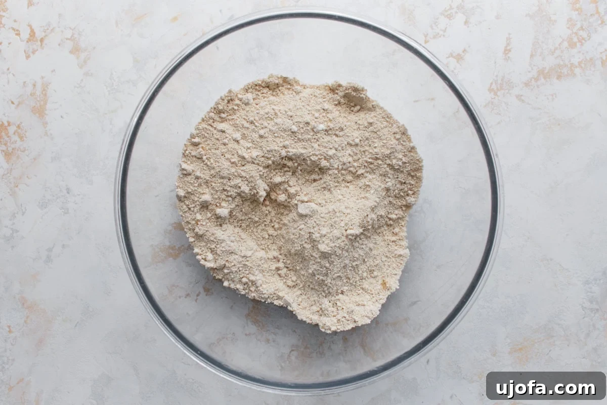 Wholesome Oat Bread 5 Homemade oat flour made from blended oats in a glass mixing bowl