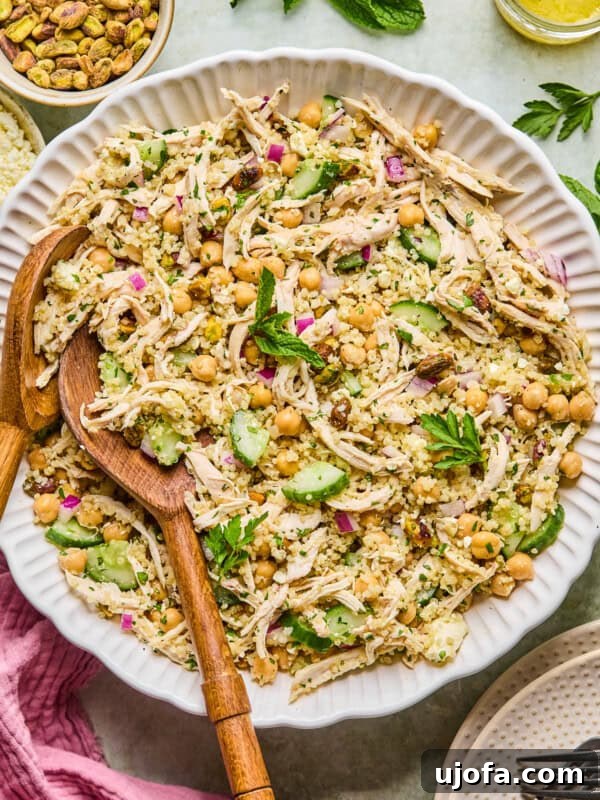 Green Goddess Chicken Salad with Extra Protein Boost 11 high protein Jennifer Aniston Salad in a bowl surrounded by a pink napkin and ingredients
