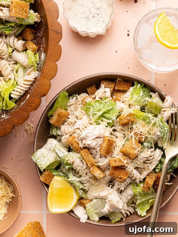 Green Goddess Chicken Salad with Extra Protein Boost 10 chicken caesar pasta salad in a bowl with a silver fork