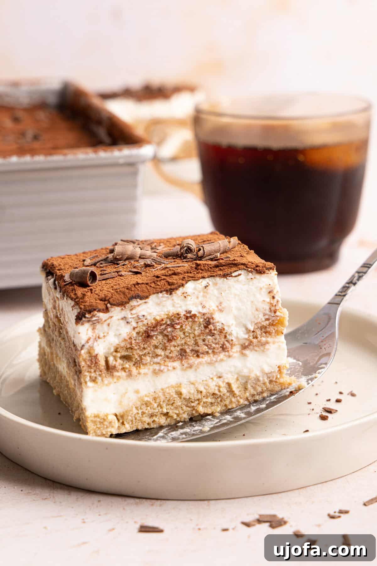 Gluten-Free Tiramisu Recipe: Authentic Italian Dessert Without Gluten 11 a spatula slicing tiramisu onto a plate