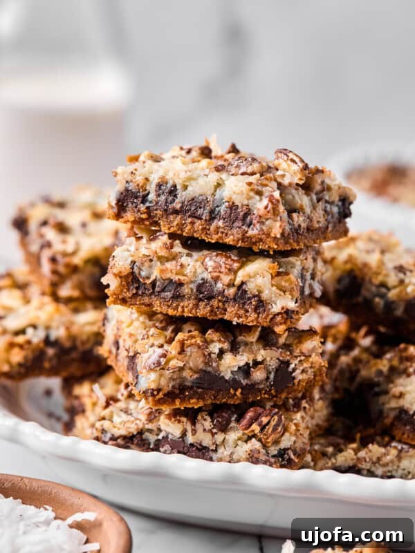 Gluten-Free Tiramisu Recipe: Authentic Italian Dessert Without Gluten 16 Close-up of a stack of gluten-free magic bar squares showing defined layers of chocolate, coconut, and pecans