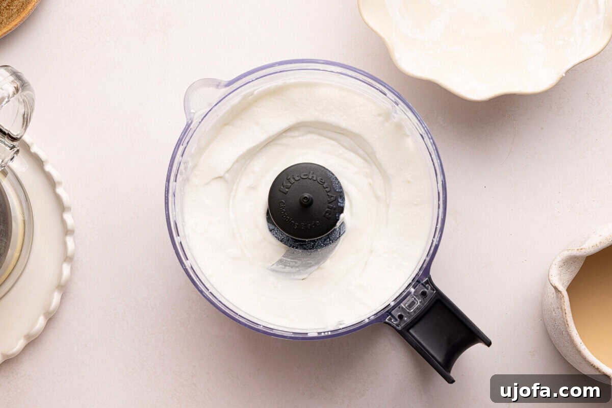 Gluten-Free Tiramisu Recipe: Authentic Italian Dessert Without Gluten 4 cottage cheese being whipped in a food processor