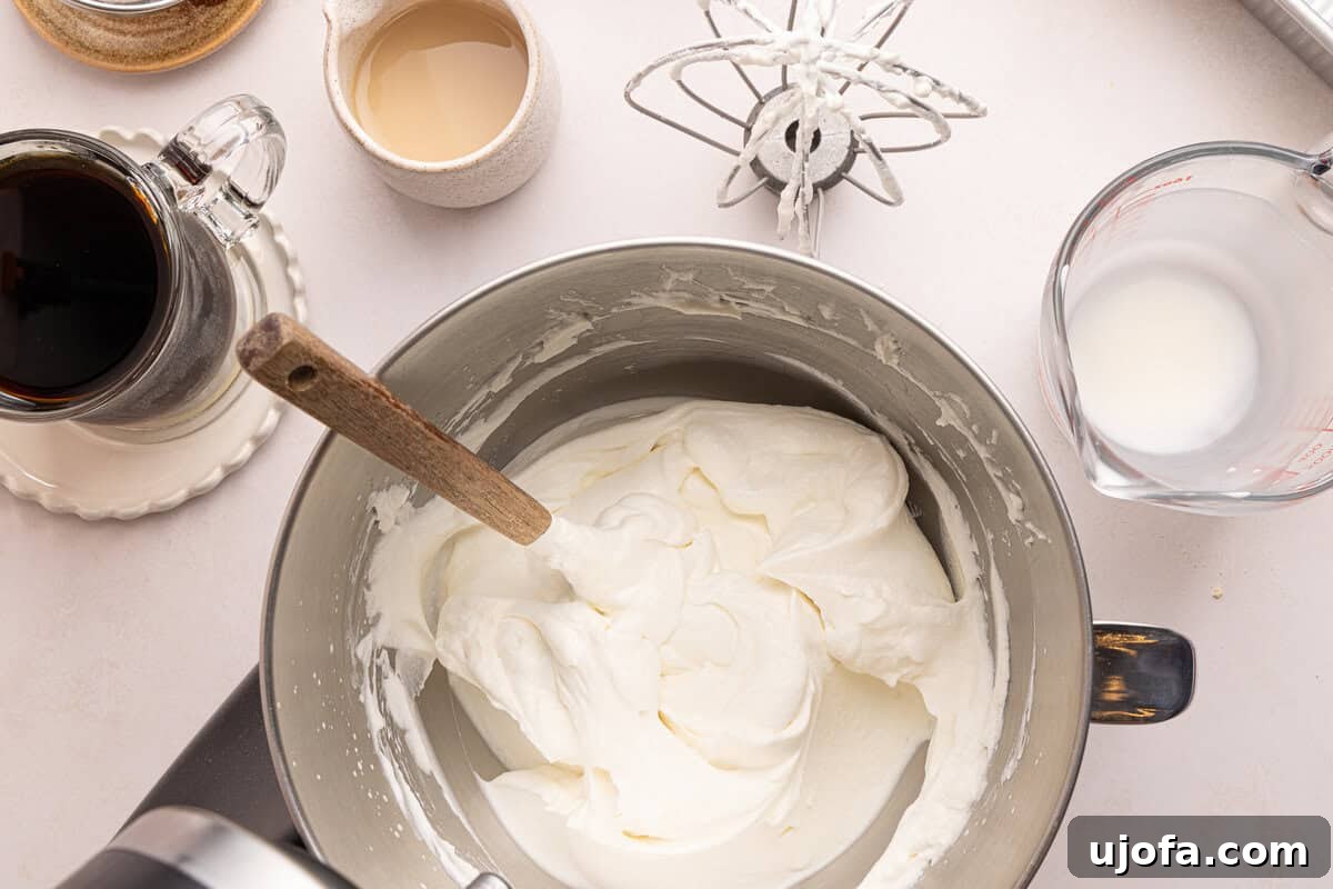 Gluten-Free Tiramisu Recipe: Authentic Italian Dessert Without Gluten 5 whipped cream in a bowl with a spatula
