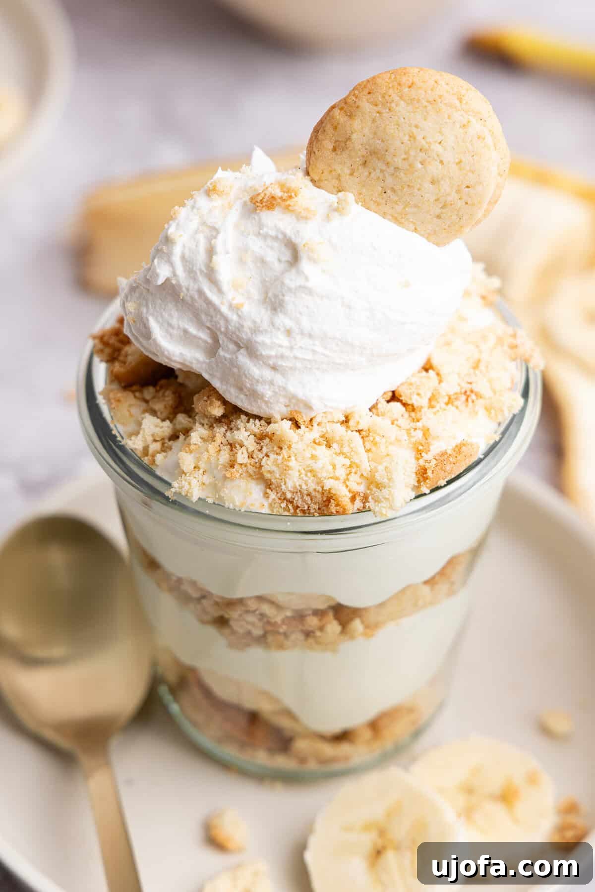 Protein-Packed Banana Pudding Cups for Muscle Fuel 9 a close up side view of a glass cup of banana pudding