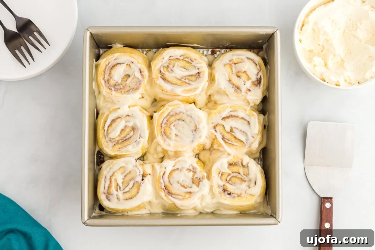 Keto cinnamon rolls baked and topped with cream cheese frosting