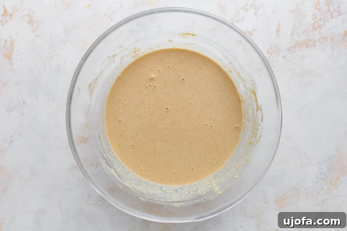 Crispy Oat Flour Waffles Recipe for Fluffy Homemade Waffles 7 Oat flour waffle batter mixed until smooth in a glass bowl.