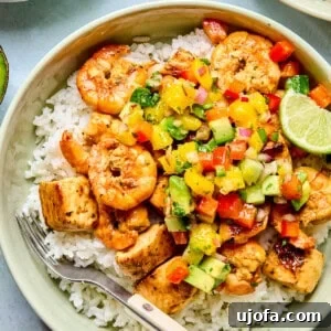 cilantro lime chicken and shrimp over rice with mango salsa