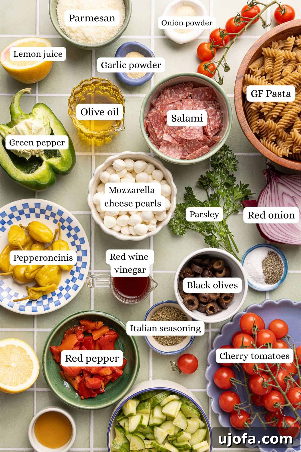 Gluten-Free Italian Pasta Salad Recipe for Flavorful Picnics 3 Ingredients for gluten free pasta salad arranged and labeled on a countertop.