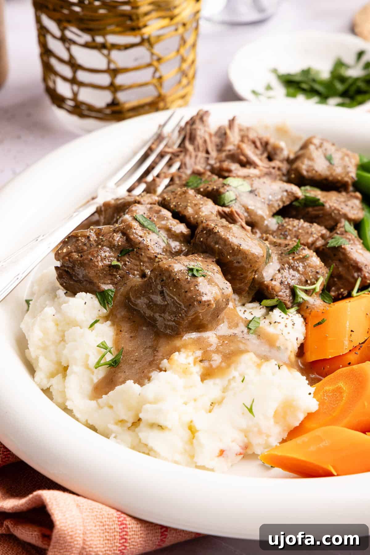 beef tips with gravy over mashed potatoes