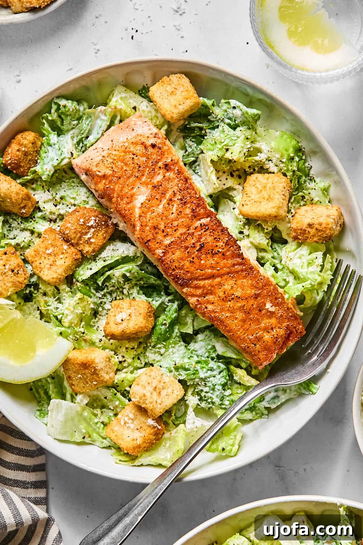 Protein-Packed Salmon Caesar with Creamy Dressing 11 salmon caesar salad in a bowl