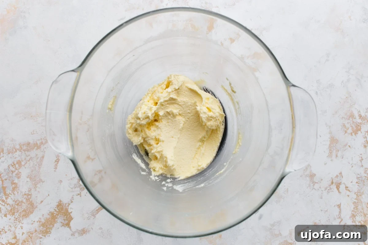 Classic Gluten-Free Victoria Sponge Cake Recipe 6 Butter and sugar creamed until pale and fluffy in a glass mixing bowl