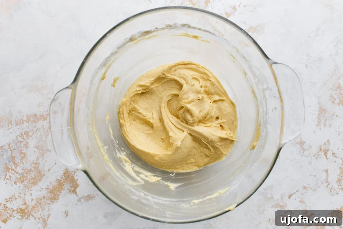 Classic Gluten-Free Victoria Sponge Cake Recipe 8 Smooth gluten-free sponge cake batter in a glass mixing bowl