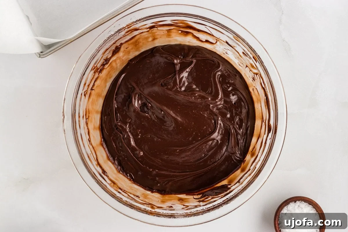 Rich Gluten-Free Dairy-Free Chocolate Fudge Recipe 6 Overhead view of dairy-free chocolate fudge mixture partially melted and swirled in a glass bowl