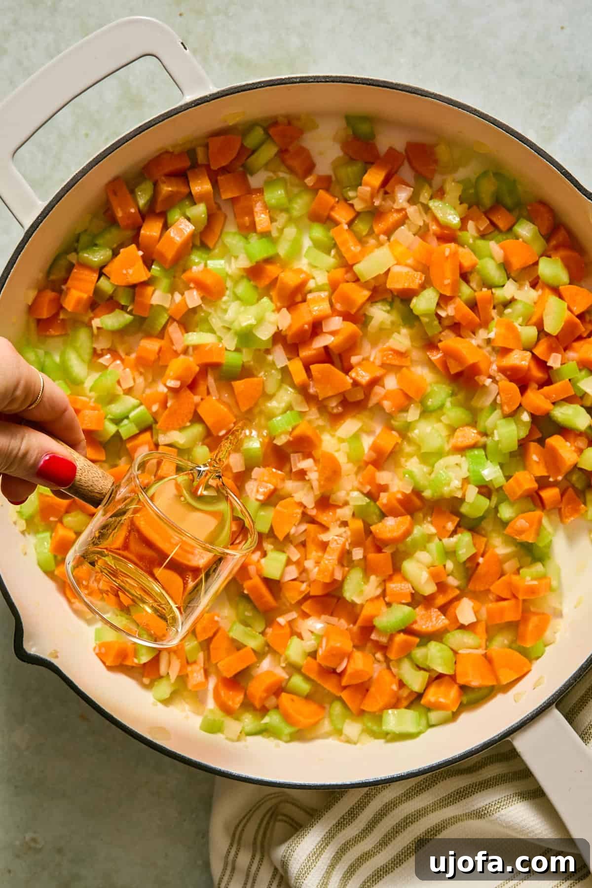 One-Pan Chicken Pot Pie Orzo 5 Sherry being added into the large skillet with the melted butter, and softened vegetables.