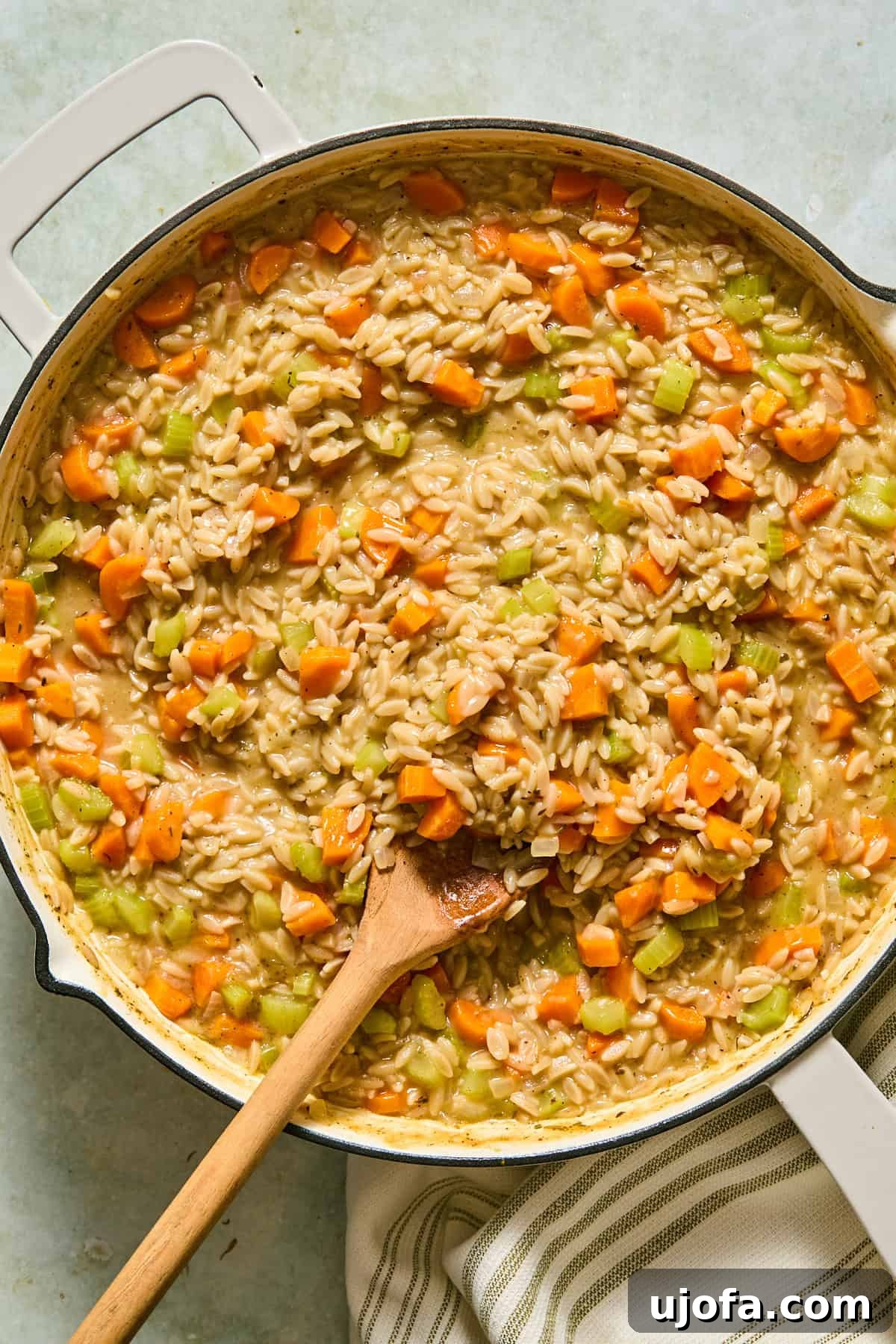 One-Pan Chicken Pot Pie Orzo 7 Orzo and vegetables simmering in broth over medium-low heat until the orzo is tender and most of the liquid is absorbed.