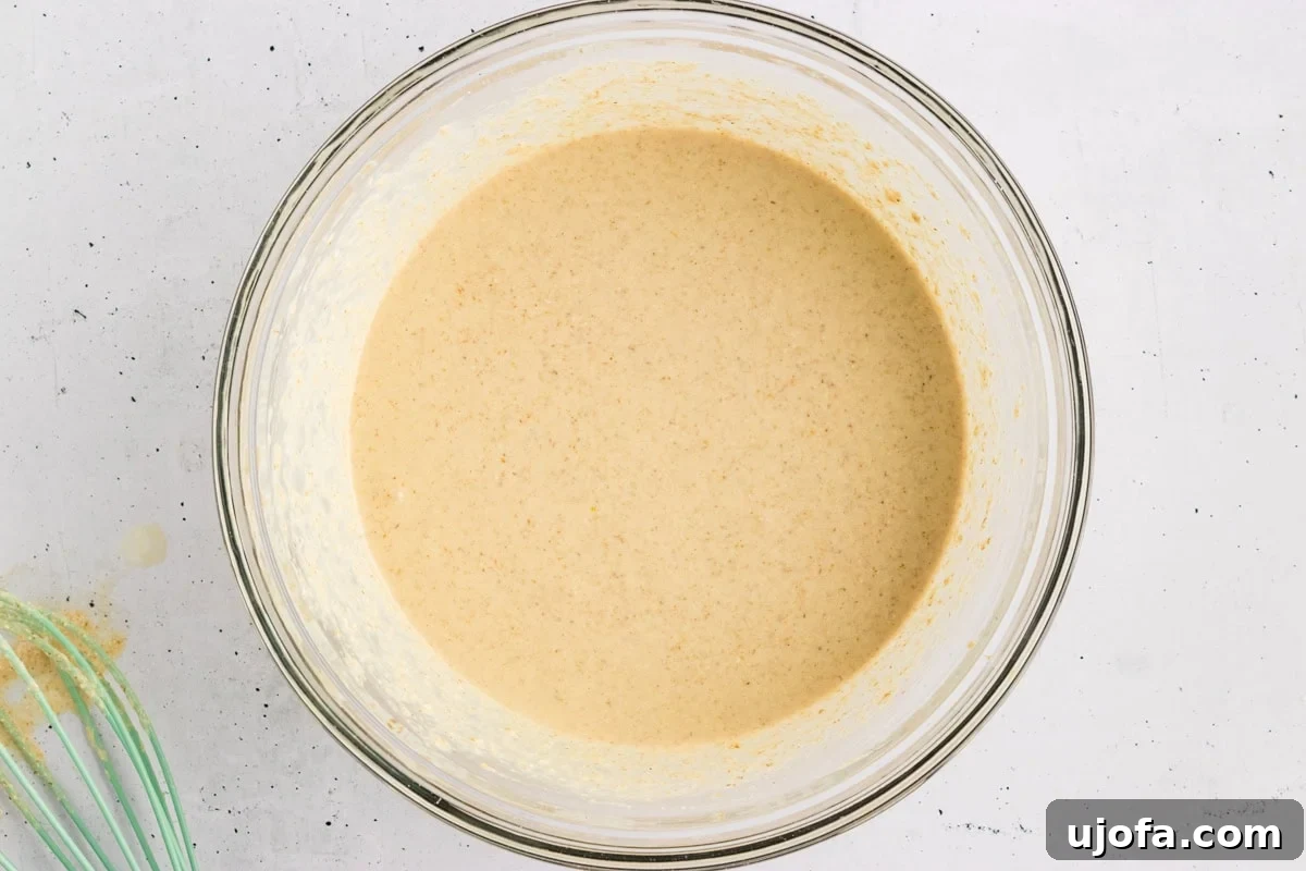 Fluffy Oat Flour Pancakes Recipe 6 Smooth, thick oat flour pancake batter in a glass mixing bowl.