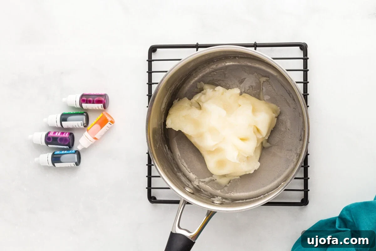 Homemade Gluten-Free Play Dough Recipe for Kids 7 thickened dough ball resting on a cooling rack after cooking on the stovetop