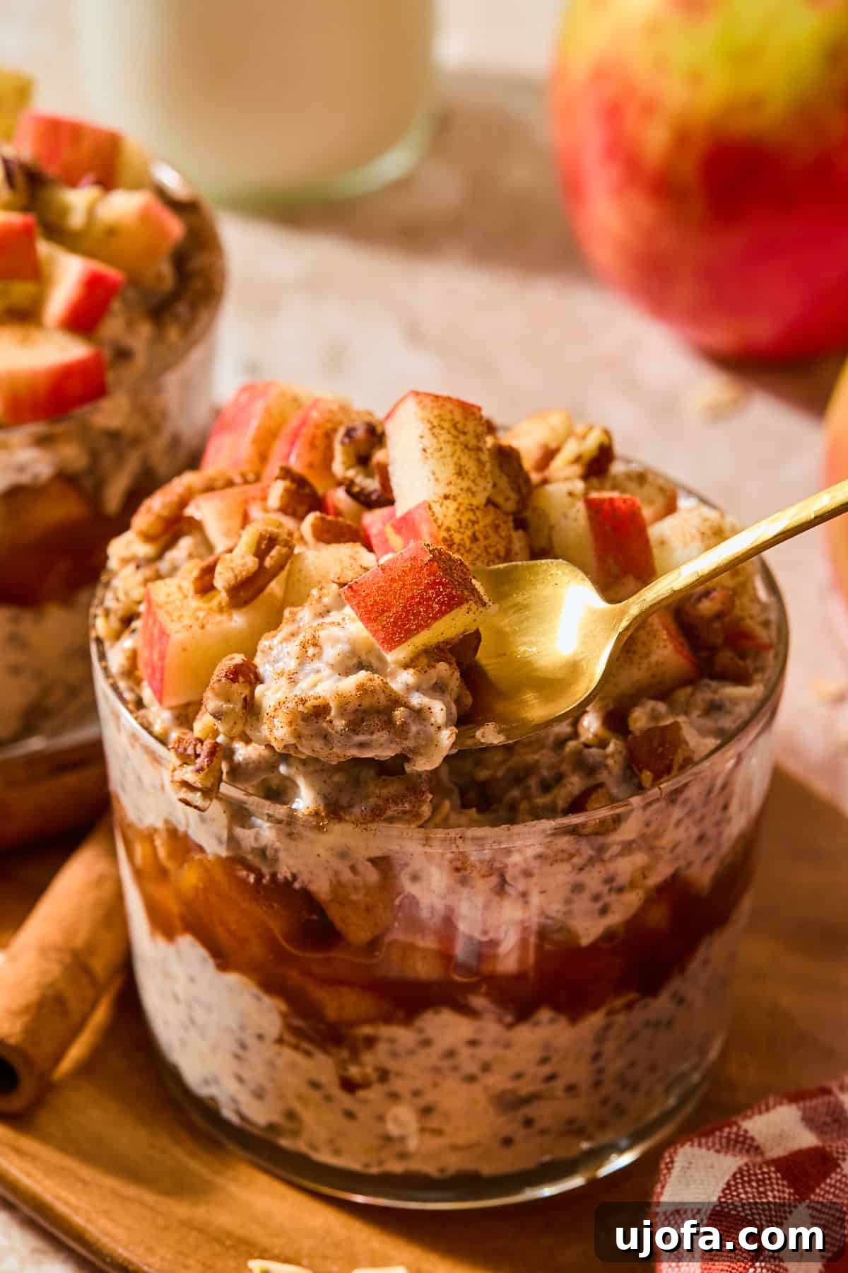 Protein-Packed Apple Pie Overnight Oats 9 apple pie overnight oats with a spoon taking a scoop out