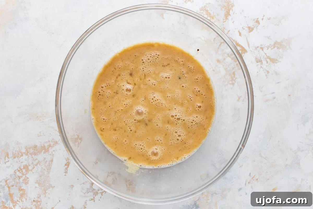 Make-Ahead Gluten-Free Breakfast Burritos 5 Whisked eggs, milk, and seasoning in a glass bowl, ready to scramble for gluten-free breakfast burritos